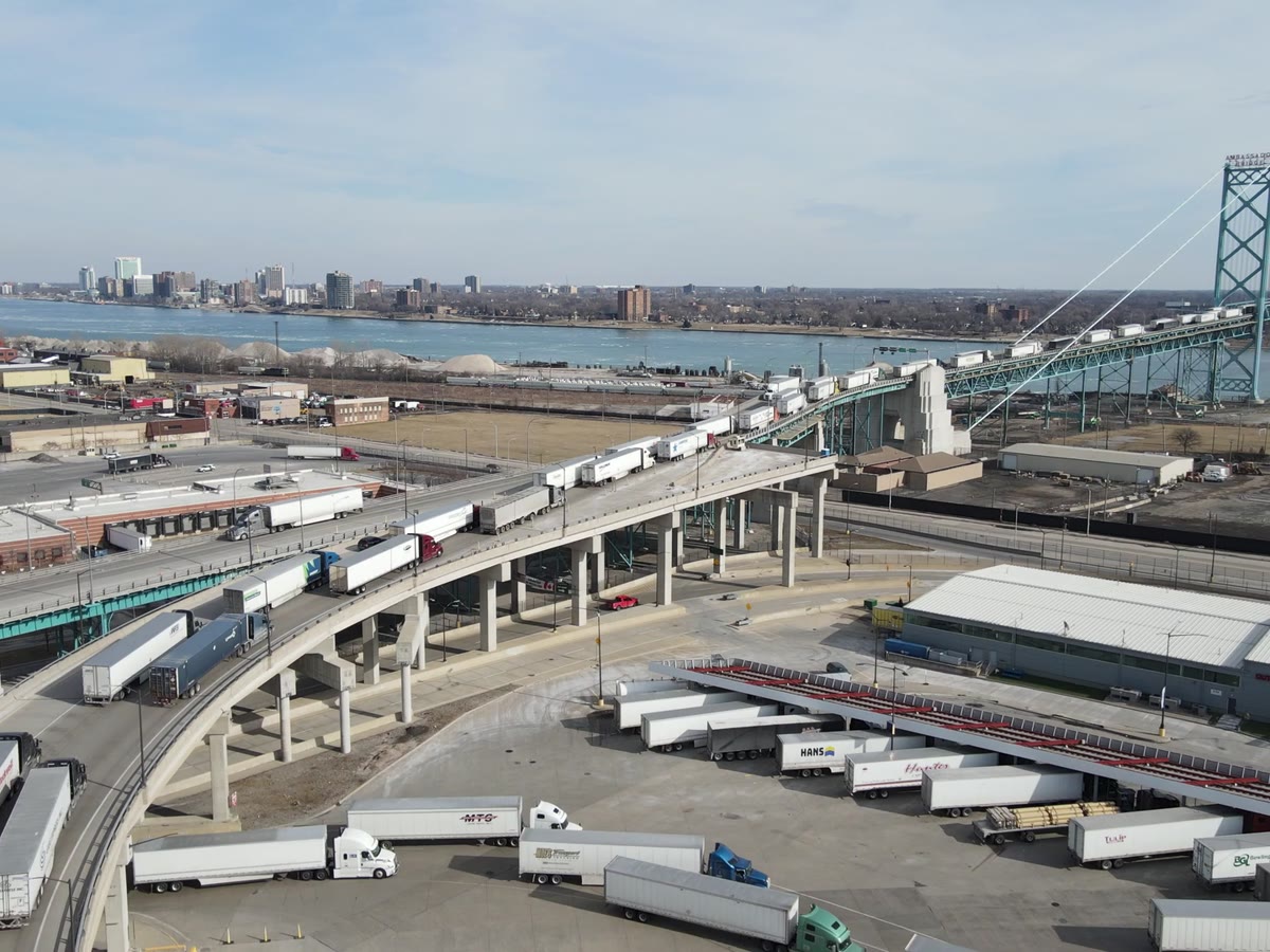 Aerial view of trucks moving through a logistics corridor